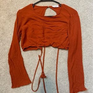 Long sleeve burnt orange open back crop top